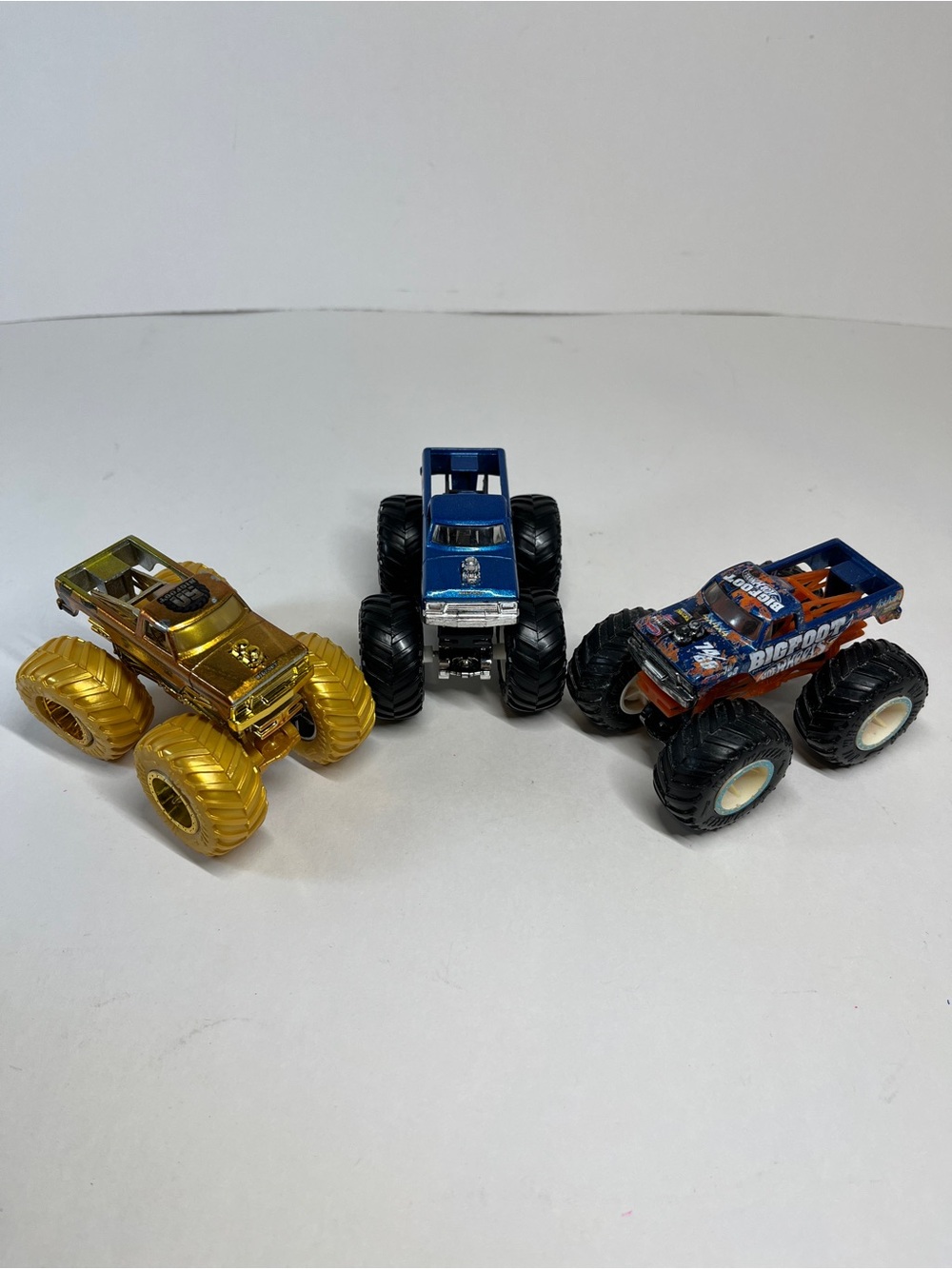 Monster Jam Trucks Lot Bigboot Gold 50 Trophy Champion Blue Firestone 1:64 Loose